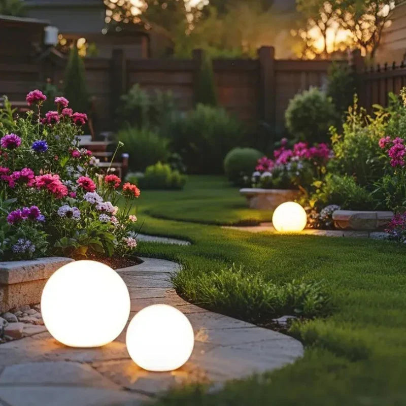 Globe lights lining a garden path