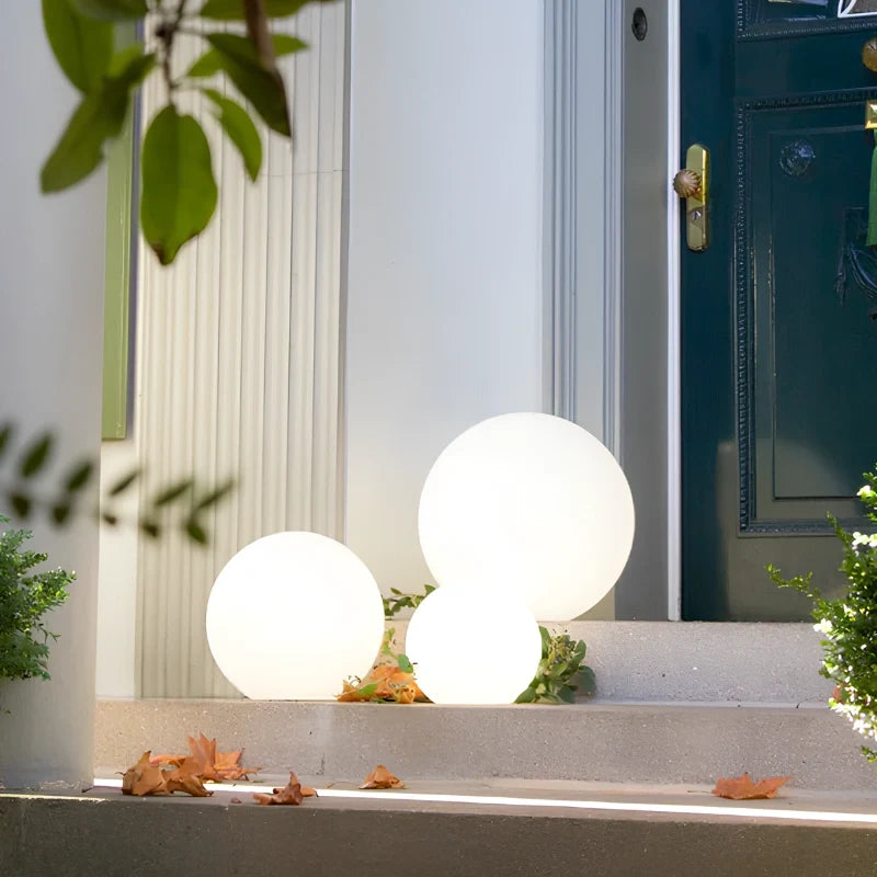 Globe lights beside a front door