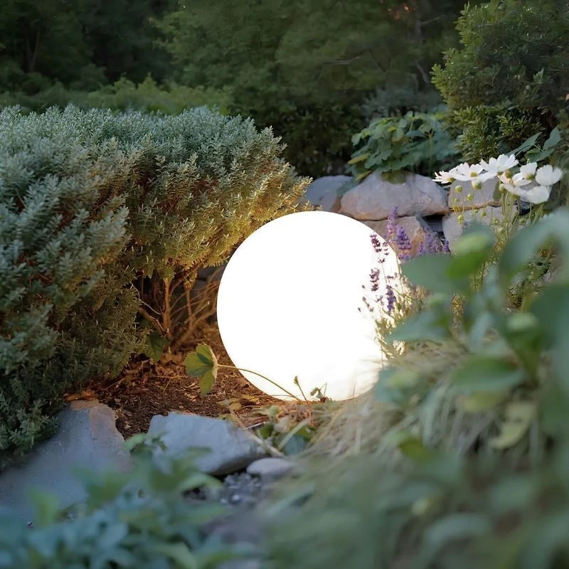 Globe light among rocks and planting