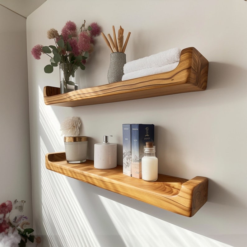 Riva shelf above a basin with towels and bottles